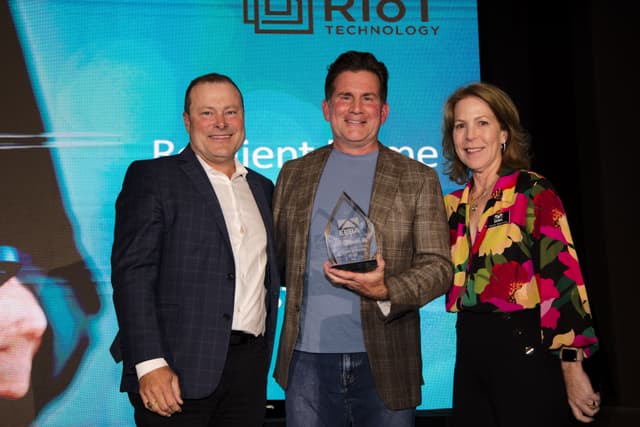 RIoT Technology accepting the 2024 EEBA Building Excellence Award